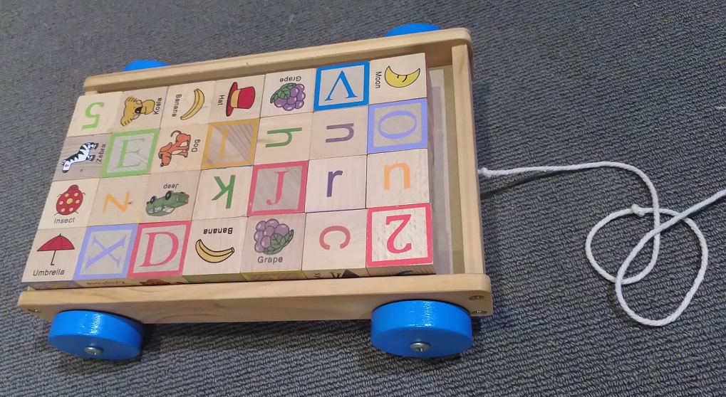 Wooden blocks shops and trolley